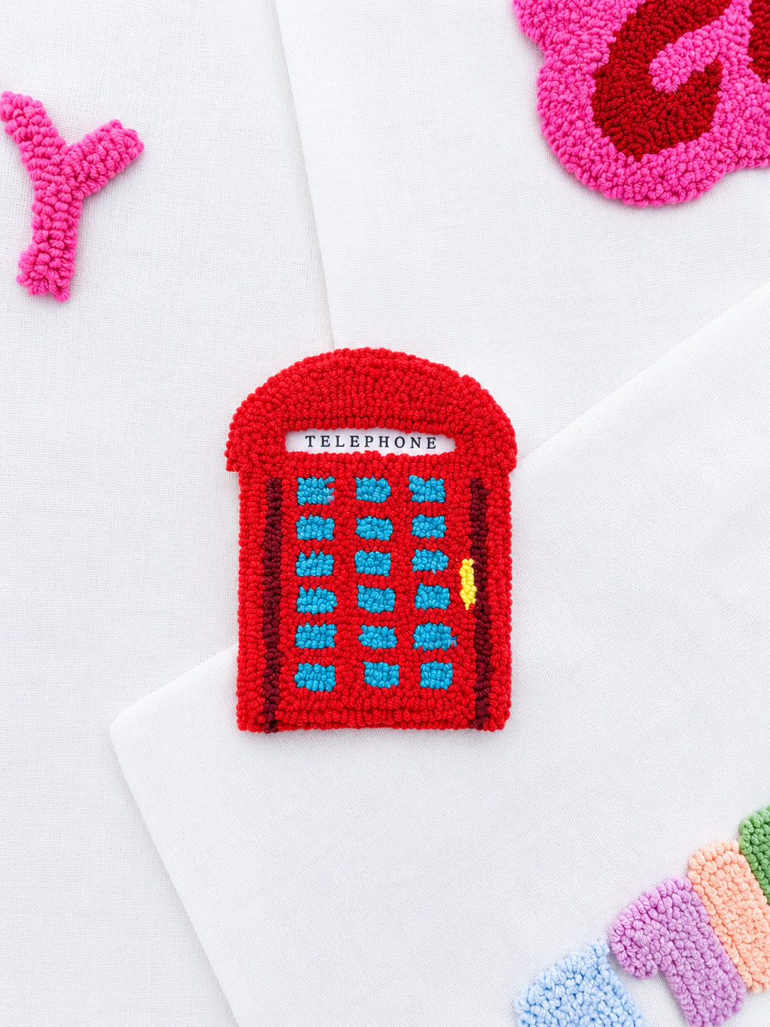 Telephone booth coaster
