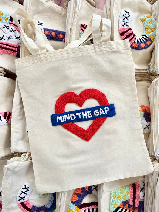 Mind the gap tote bag