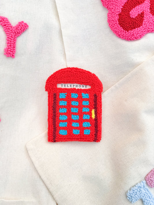 Telephone booth coaster